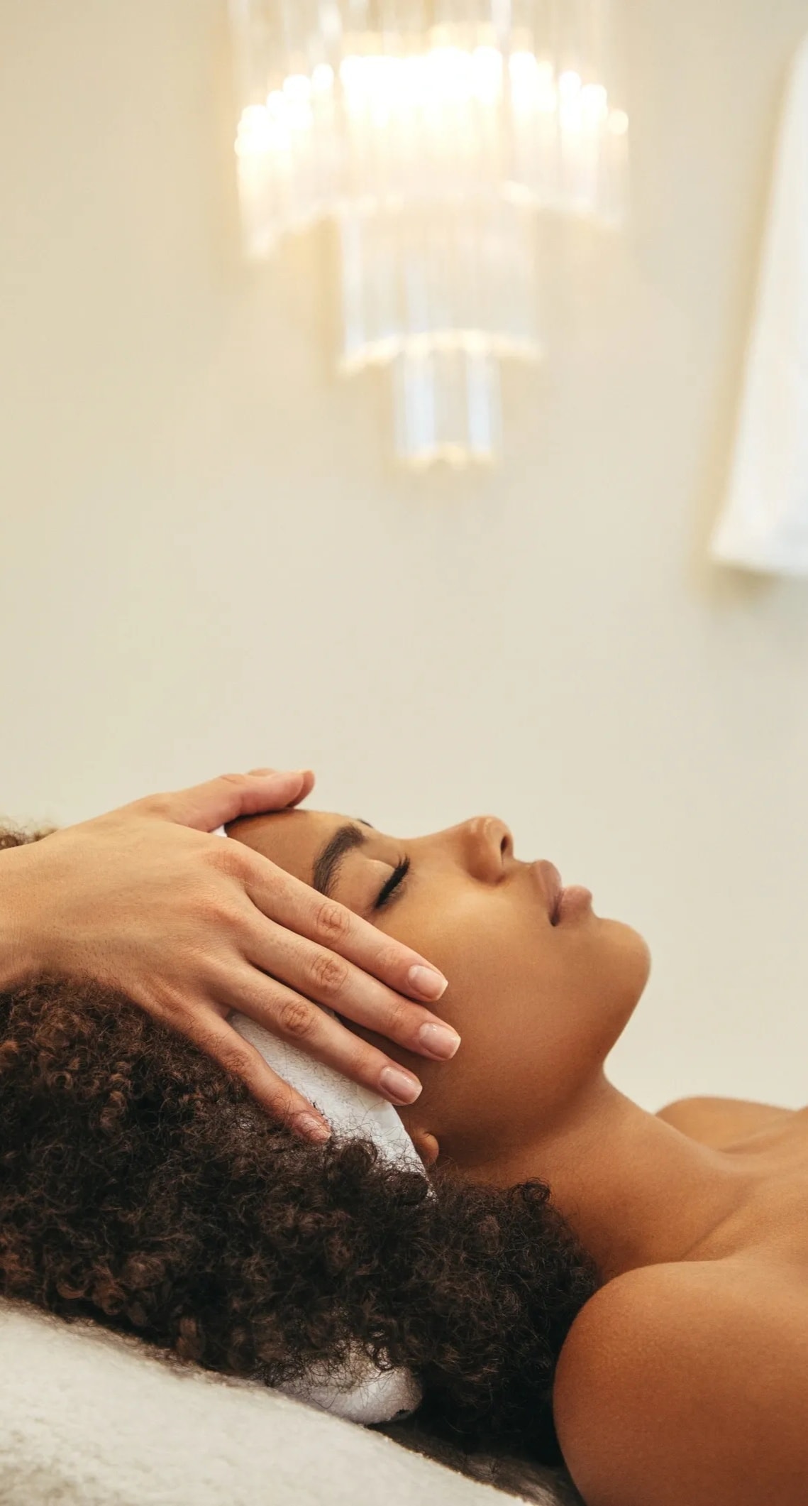 Woman receiving facial massage spa treatment